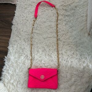 Neon pink Tory Burch bag with gold chain